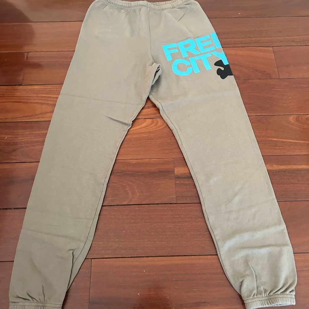 Women’s free city Tan Joggers with Blue Logo